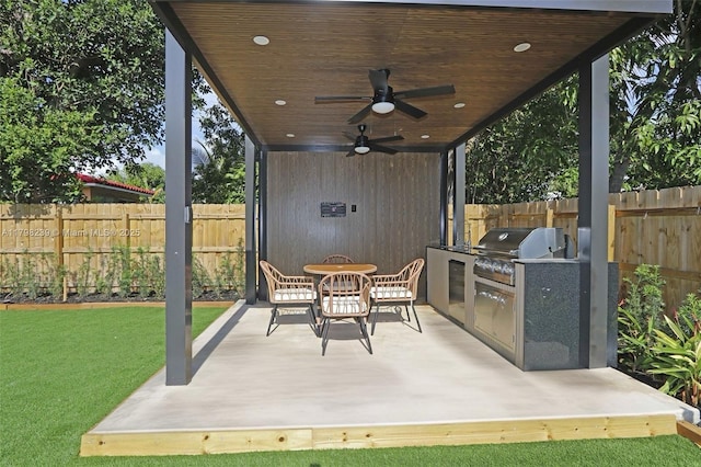 231 NE 45th St, Miami, FL 33137 - view of patio / terrace featuring an outdoor kitchen, area for grilling, ceiling fan, and a fenced backyard