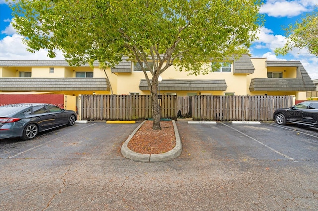 8425 SW 137th Ave Unit 8425, Miami, FL 33183 - uncovered parking lot featuring fence