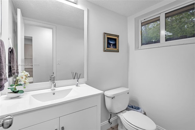 8425 SW 137th Ave Unit 8425, Miami, FL 33183 - bathroom featuring a textured ceiling, toilet, vanity, and baseboards