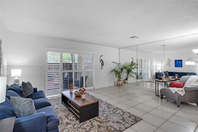 8425 SW 137th Ave Unit 8425, Miami, FL 33183 - living room with a textured ceiling and light tile patterned floors