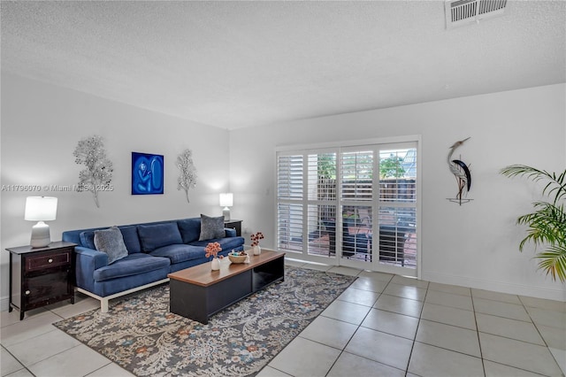 8425 SW 137th Ave Unit 8425, Miami, FL 33183 - living room with tile patterned flooring, a textured ceiling, and baseboards
