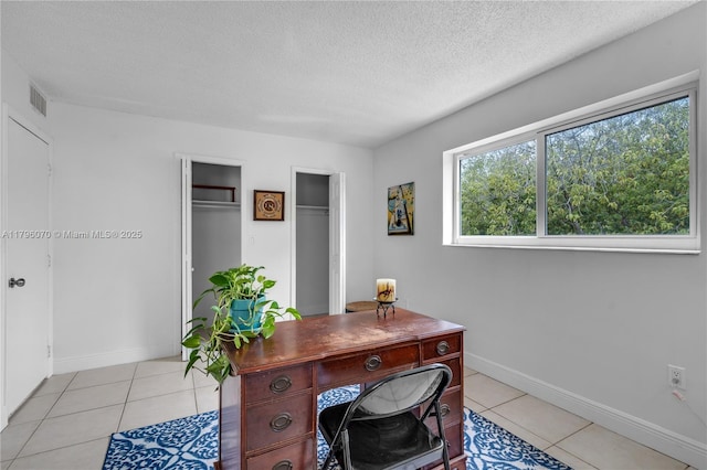 8425 SW 137th Ave Unit 8425, Miami, FL 33183 - office featuring baseboards, light tile patterned flooring, and a textured ceiling