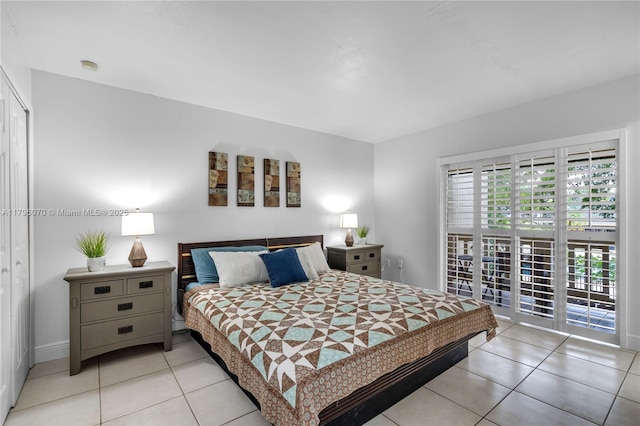 8425 SW 137th Ave Unit 8425, Miami, FL 33183 - bedroom with access to exterior, light tile patterned floors, a closet, and baseboards