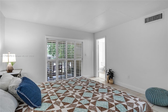 8425 SW 137th Ave Unit 8425, Miami, FL 33183 - tiled bedroom featuring baseboards and ensuite bathroom