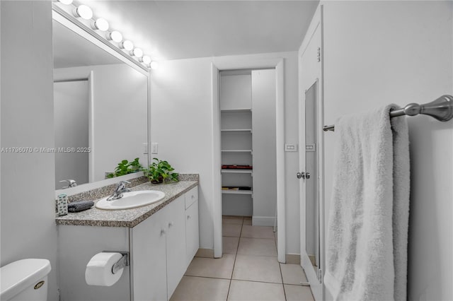 8425 SW 137th Ave Unit 8425, Miami, FL 33183 - bathroom with tile patterned flooring, toilet, vanity, and baseboards