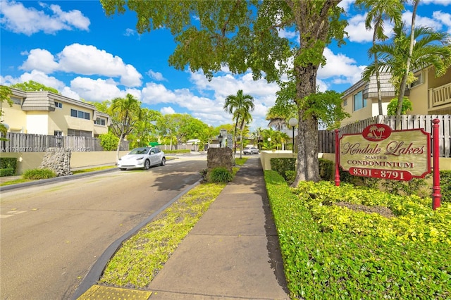 8425 SW 137th Ave Unit 8425, Miami, FL 33183 - view of asphalt road with sidewalks, a residential view, curbs, and street lights
