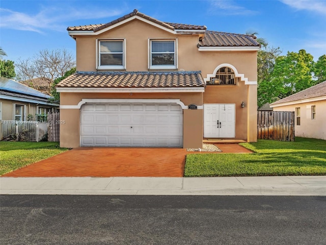 10273 SW 16th Ct, Pembroke Pines, FL 33025 - mediterranean / spanish-style house with an attached garage, a tile roof, stucco siding, and concrete driveway