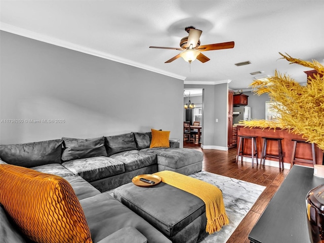 10273 SW 16th Ct, Pembroke Pines, FL 33025 - living room featuring ceiling fan, dark wood-style floors, ornamental molding, a chandelier, and baseboards
