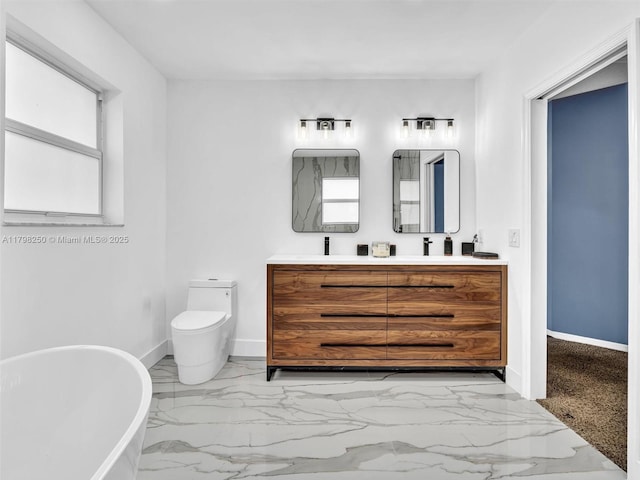 10273 SW 16th Ct, Pembroke Pines, FL 33025 - full bath with double vanity, marble finish floors, a freestanding bath, and baseboards
