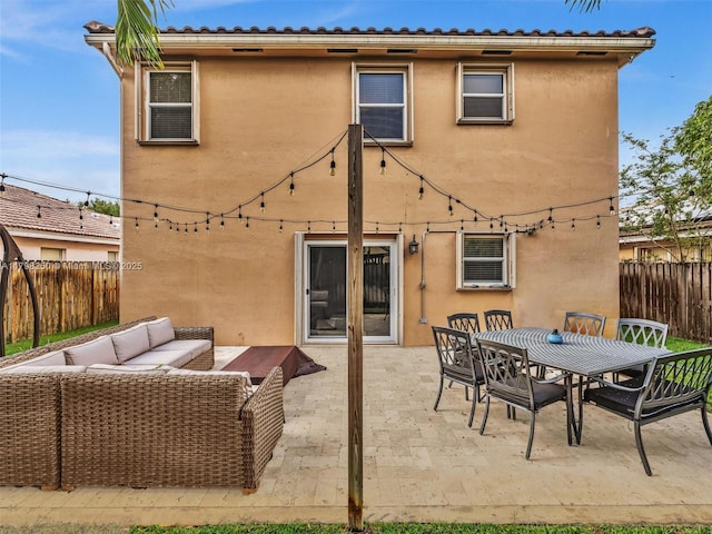 10273 SW 16th Ct, Pembroke Pines, FL 33025 - rear view of property featuring an outdoor hangout area, stucco siding, a fenced backyard, and a patio area