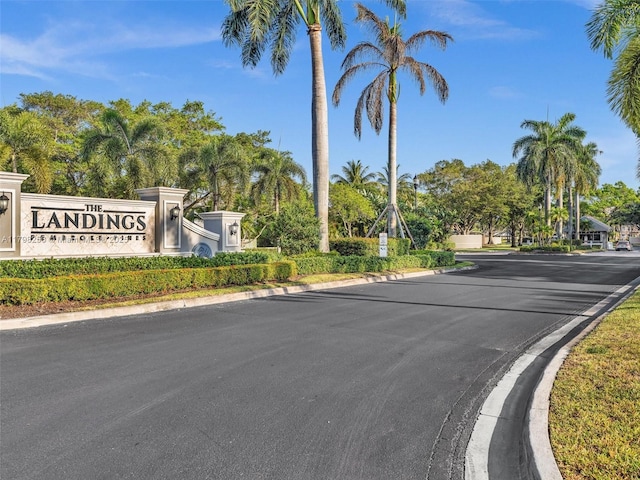 10273 SW 16th Ct, Pembroke Pines, FL 33025 - view of asphalt road with curbs and view of wooded area