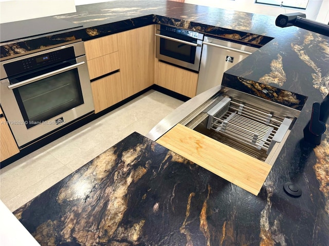 19614 SW 133rd Ct, Miami, FL 33177 - kitchen featuring light brown cabinets, oven, and dark countertops