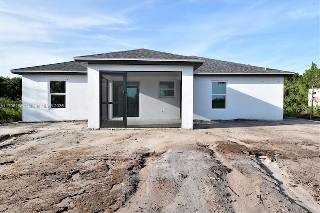 4463 60th Ave NE, Naples, FL 34120 - rear view of property featuring stucco siding and roof with shingles