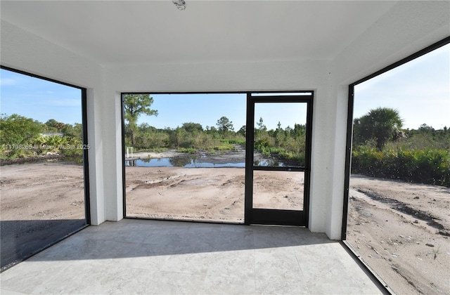 4463 60th Ave NE, Naples, FL 34120 - unfurnished sunroom with concrete flooring