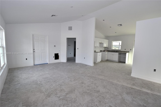 4463 60th Ave NE, Naples, FL 34120 - unfurnished living room with high vaulted ceiling and baseboards