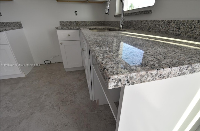 4463 60th Ave NE, Naples, FL 34120 - kitchen with white cabinets and light stone counters