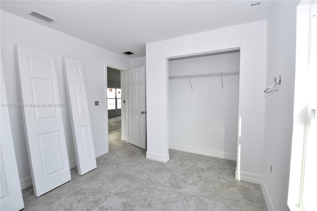 4463 60th Ave NE, Naples, FL 34120 - unfurnished bedroom featuring a closet and baseboards