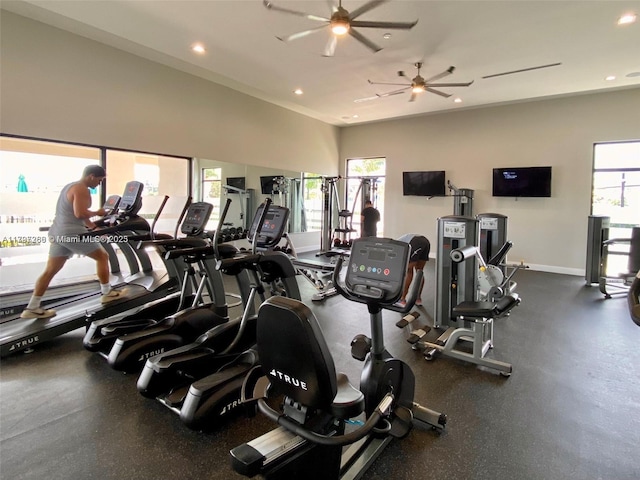 exercise room featuring recessed lighting, a ceiling fan, and baseboards