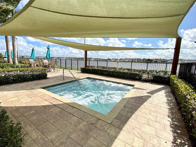 view of swimming pool featuring a community hot tub, fence, a patio, and outdoor dining area