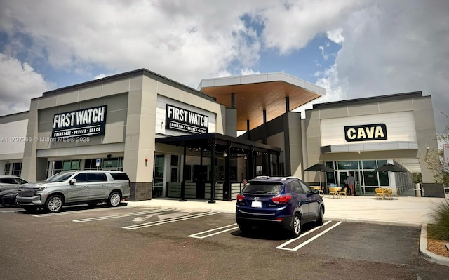view of commercial location featuring uncovered parking