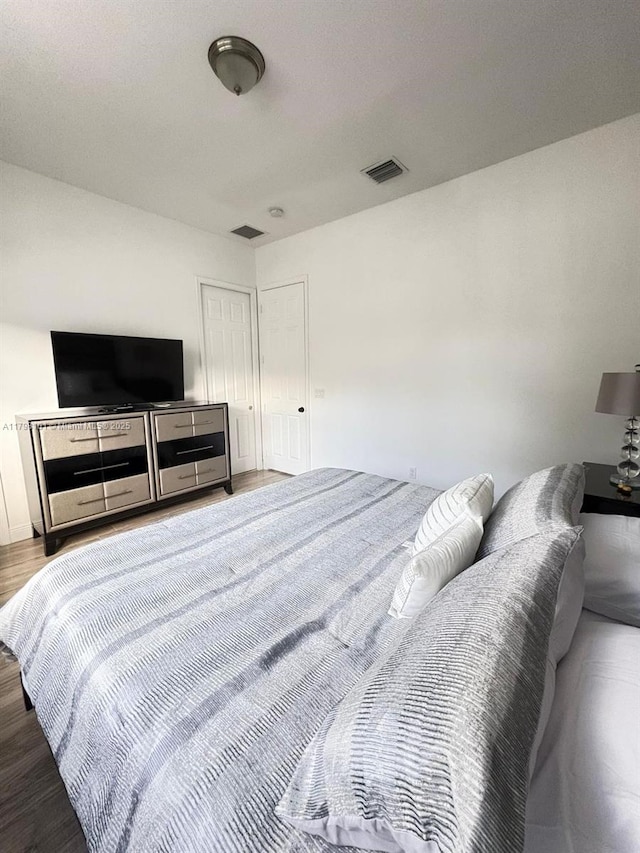 bedroom with wood finished floors
