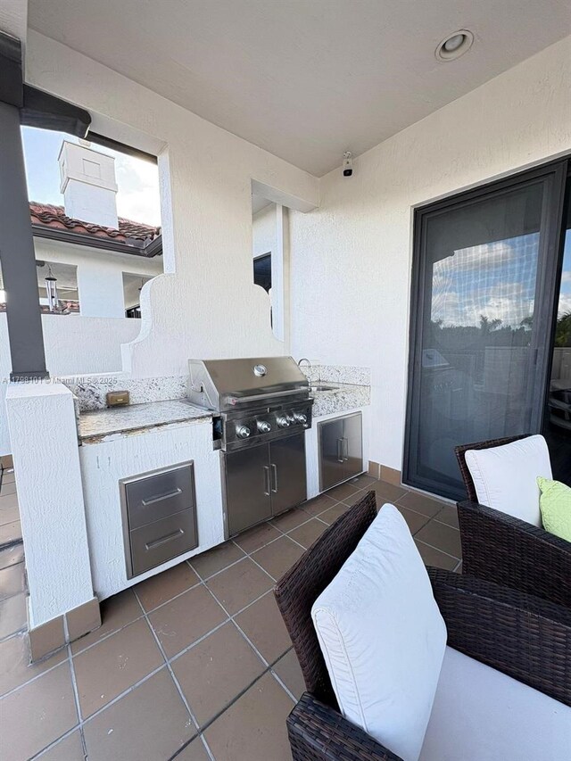 view of patio featuring area for grilling and grilling area