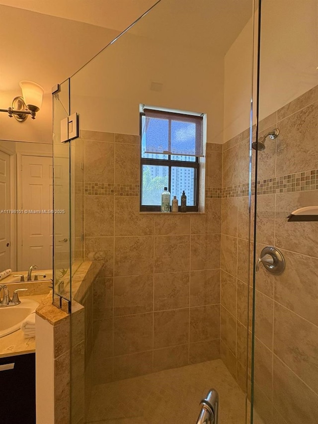 full bath featuring a shower stall and vanity