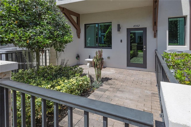 4962 NW 83rd Path Unit 4962, Doral, FL 33166 - view of exterior entry with stucco siding and a balcony