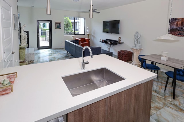 4962 NW 83rd Path Unit 4962, Doral, FL 33166 - kitchen featuring light marble finish flooring, a sink, open floor plan, and light countertops