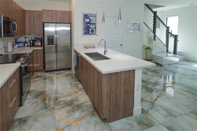 4962 NW 83rd Path Unit 4962, Doral, FL 33166 - kitchen featuring stainless steel appliances, a sink, light marble finish floors, modern cabinets, and a peninsula