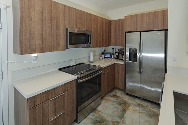 4962 NW 83rd Path Unit 4962, Doral, FL 33166 - kitchen with stainless steel appliances, light marble finish floors, light countertops, modern cabinets, and brown cabinets