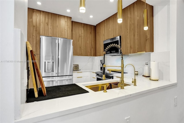 1980 S Ocean Dr Unit 19H, Hallandale Beach, FL 33009 - kitchen with appliances with stainless steel finishes, brown cabinetry, decorative backsplash, modern cabinets, and recessed lighting