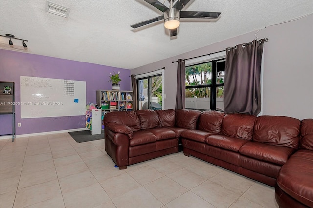 11733 NW 11th St, Pembroke Pines, FL 33026 - living area with a textured ceiling, ceiling fan, light tile patterned floors, and baseboards