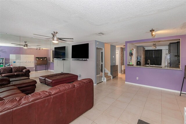11733 NW 11th St, Pembroke Pines, FL 33026 - living area featuring ceiling fan, light tile patterned flooring, a textured ceiling, baseboards, and stairway