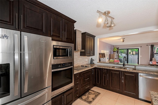 11733 NW 11th St, Pembroke Pines, FL 33026 - kitchen featuring stainless steel appliances, a sink, light tile patterned flooring, wall chimney range hood, and light stone countertops