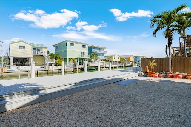view of yard featuring a residential view and fence