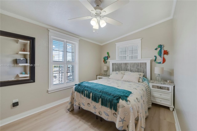 bedroom featuring wood finished floors, baseboards, crown molding, and ceiling fan