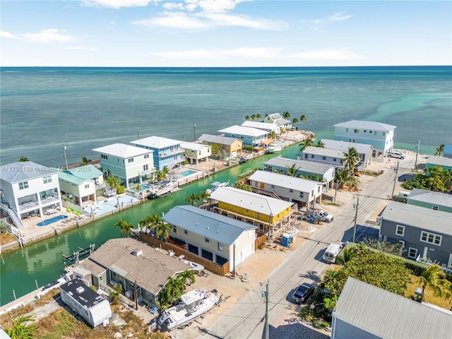 aerial view of residential area with a large body of water