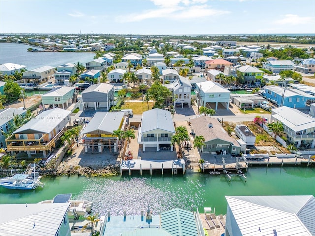 aerial view of residential area with a nearby body of water