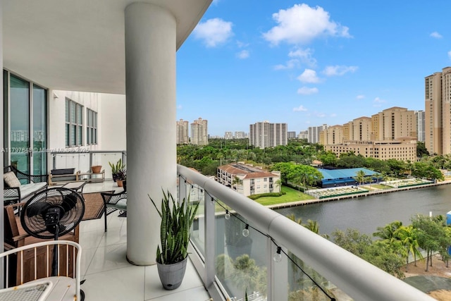 balcony featuring a water view and a view of city