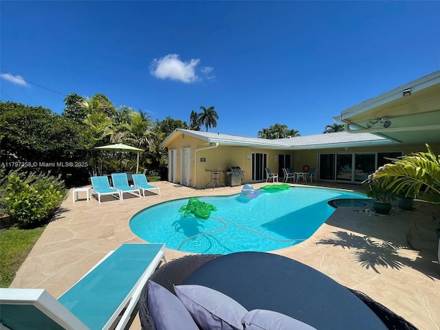 4410 N Buchanan St, Hollywood, FL 33021 - outdoor pool featuring a patio and a grill