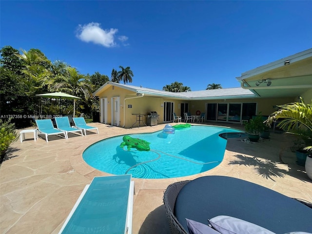 4410 N Buchanan St, Hollywood, FL 33021 - outdoor pool with a patio area and area for grilling