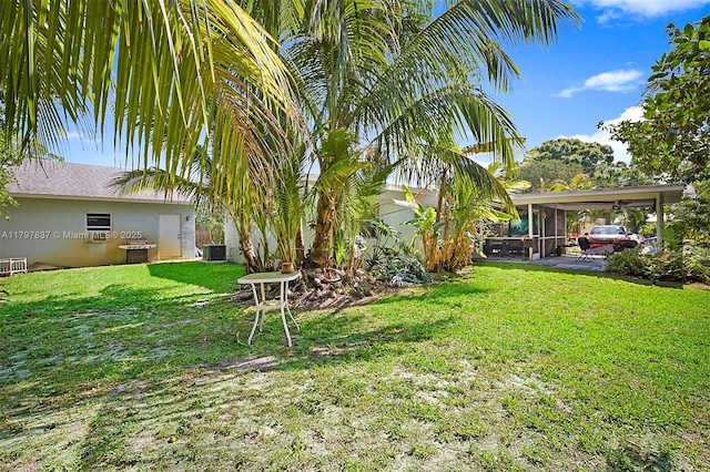 view of grassy yard featuring a sunroom and central air condition unit