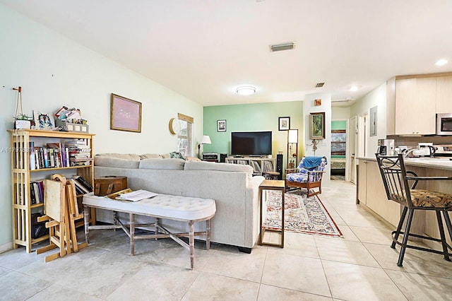 602 S Caloosahatchee Ave, Jupiter, FL 33458 - living room featuring light tile patterned floors and recessed lighting
