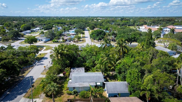 aerial view of property and surrounding area with nearby suburban area