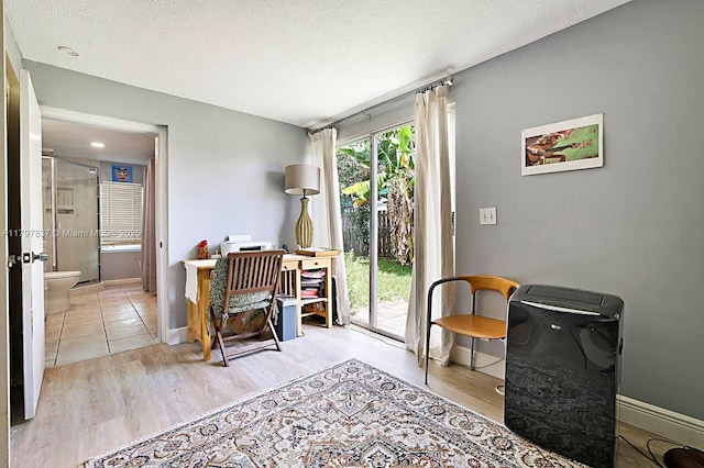 602 S Caloosahatchee Ave, Jupiter, FL 33458 - sitting room with wood finished floors, a textured ceiling, and an office area
