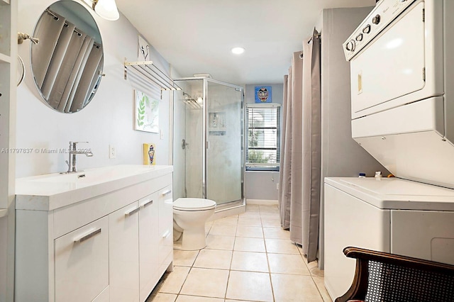 602 S Caloosahatchee Ave, Jupiter, FL 33458 - full bath with stacked washing machine and dryer, a shower stall, tile patterned floors, and plenty of natural light
