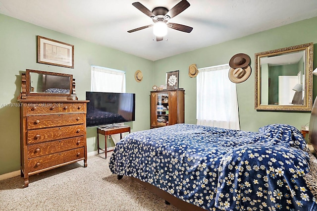 602 S Caloosahatchee Ave, Jupiter, FL 33458 - carpeted bedroom with baseboards and a ceiling fan