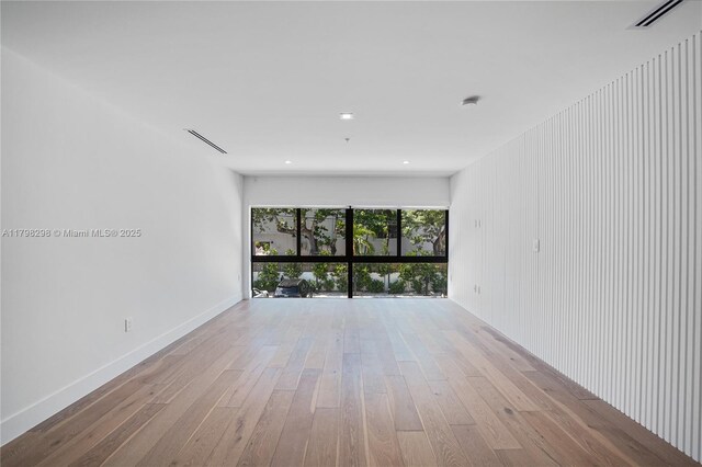 204 Sunrise Dr Unit 204D, Key Biscayne, FL 33149 - spare room featuring hardwood / wood-style flooring, baseboards, and recessed lighting