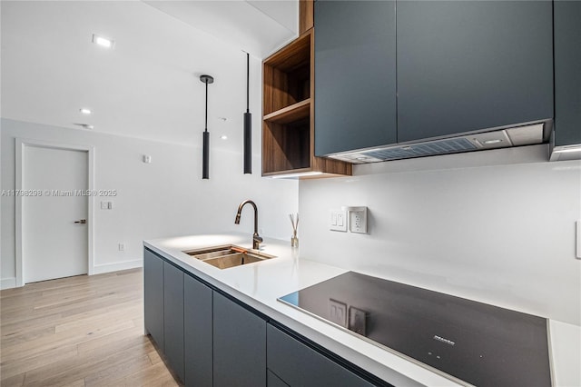 204 Sunrise Dr Unit 204D, Key Biscayne, FL 33149 - kitchen featuring a sink, black electric cooktop, light wood finished floors, light countertops, and modern cabinets